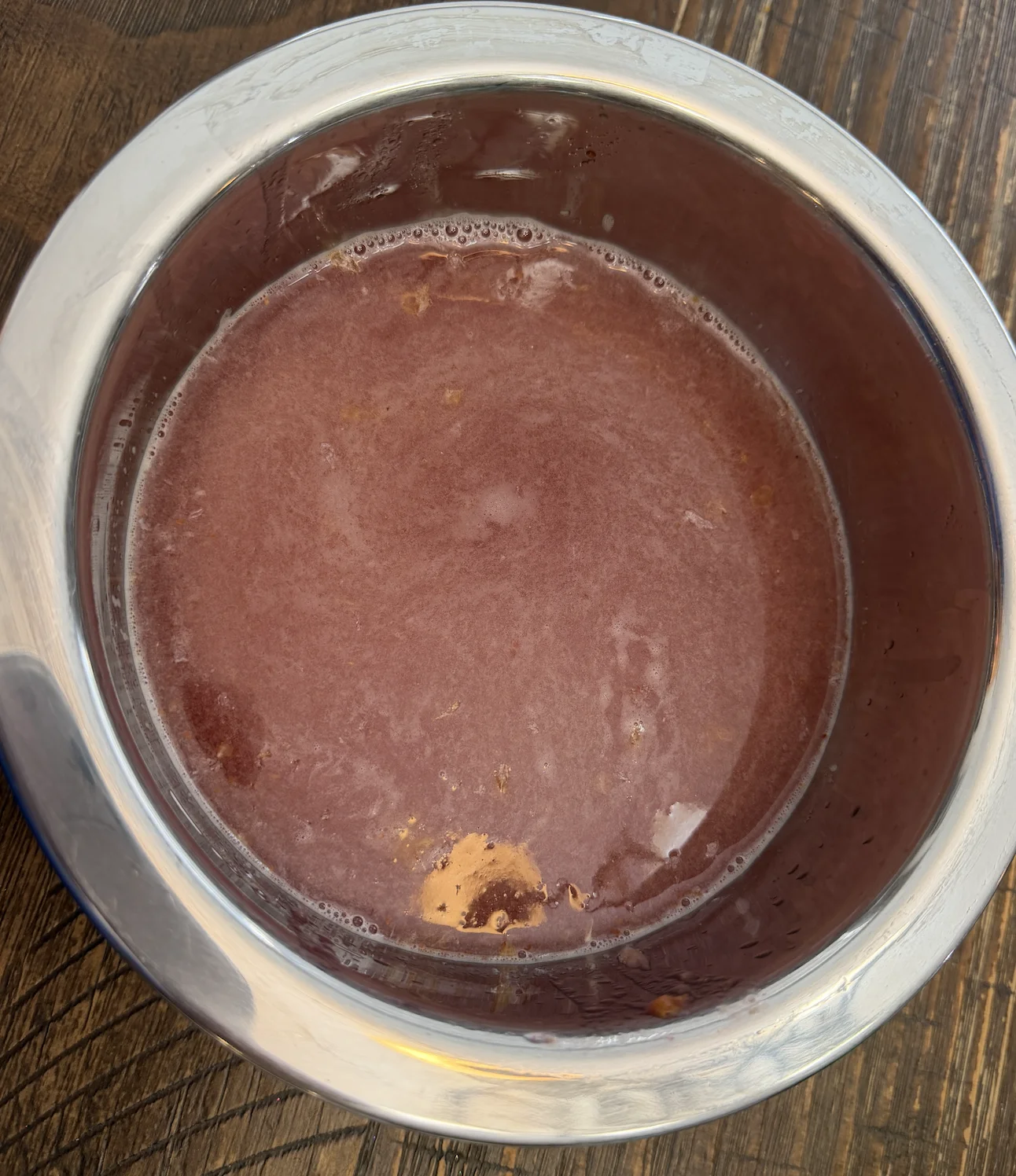 Fresh blueberry lemonade mixture with muddled blueberries