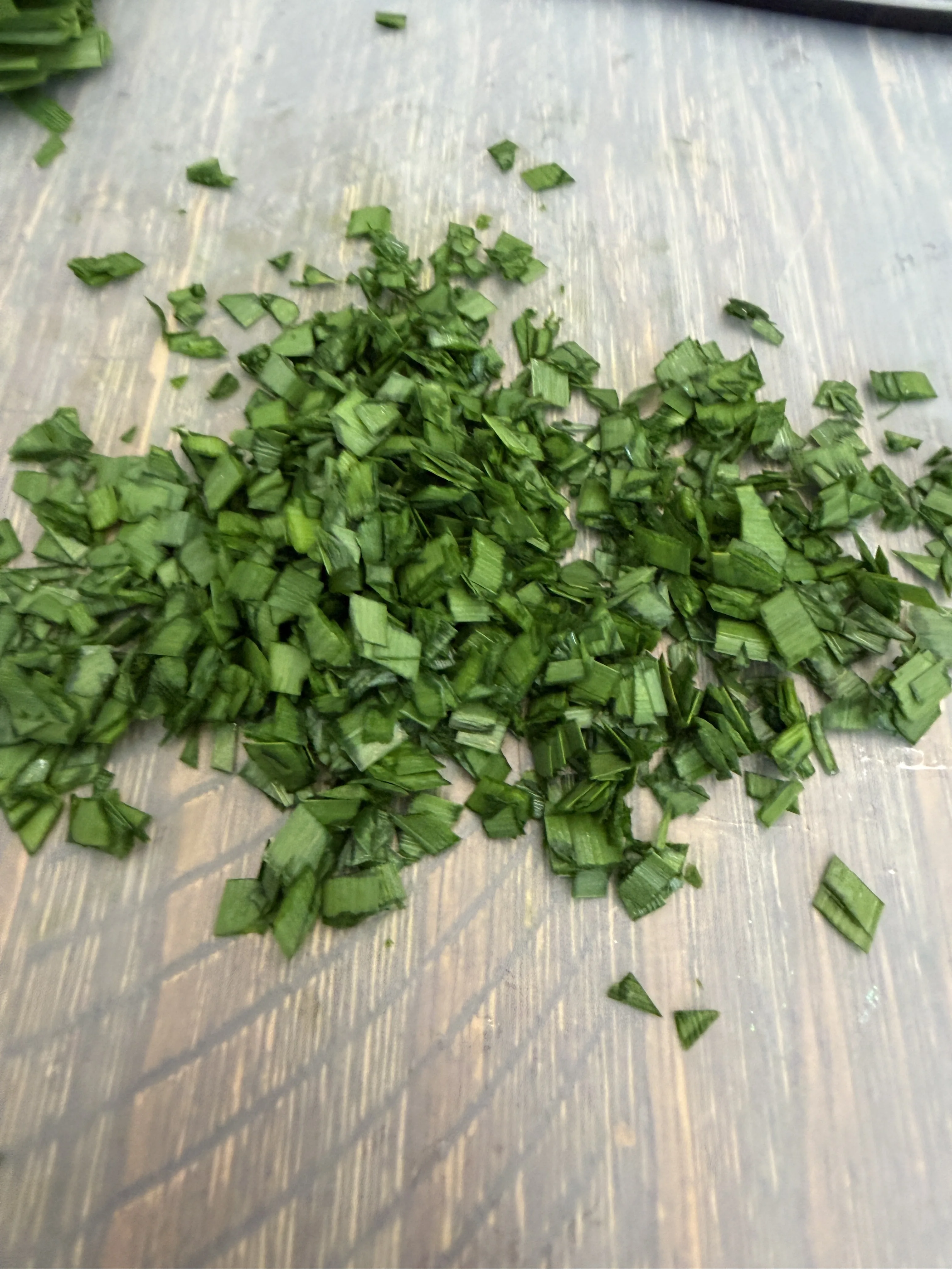 Finely chopped Chinese chives ready to mix into dumpling filling