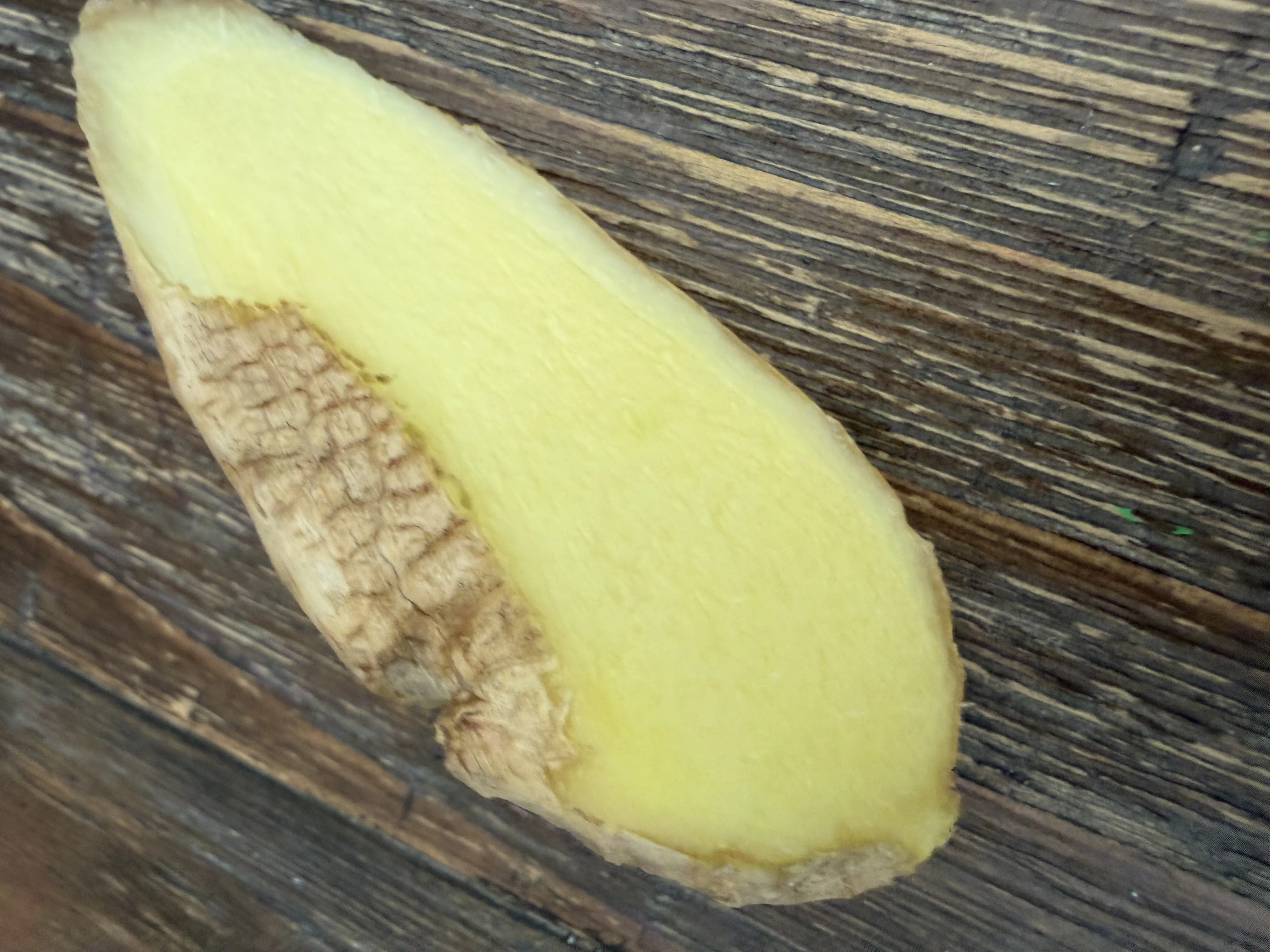 Fresh ginger root peeled and ready to mince