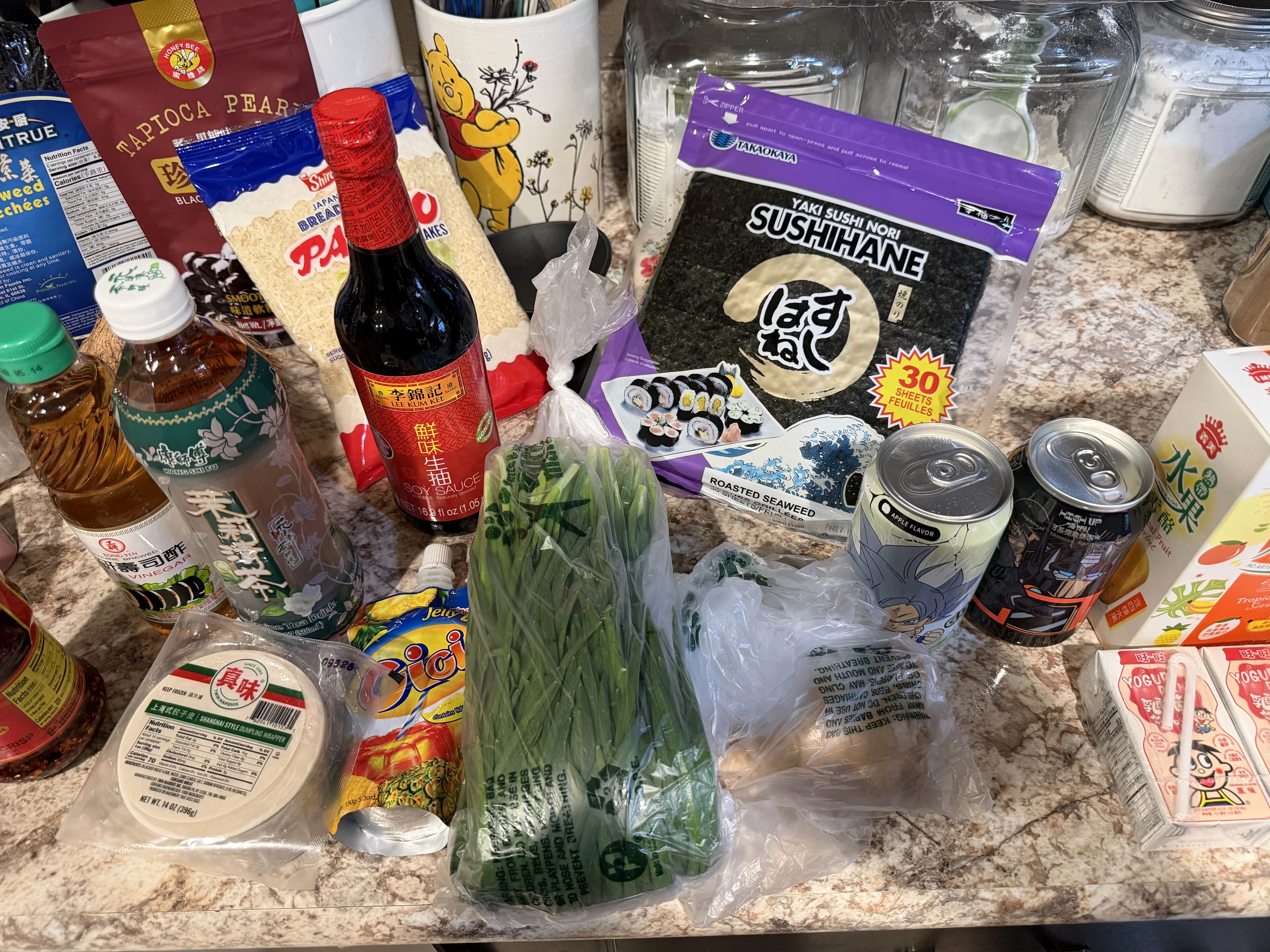 Hong Kong Market haul - soy sauce, tapioca pearls, nori sheets, green onions, and sauces