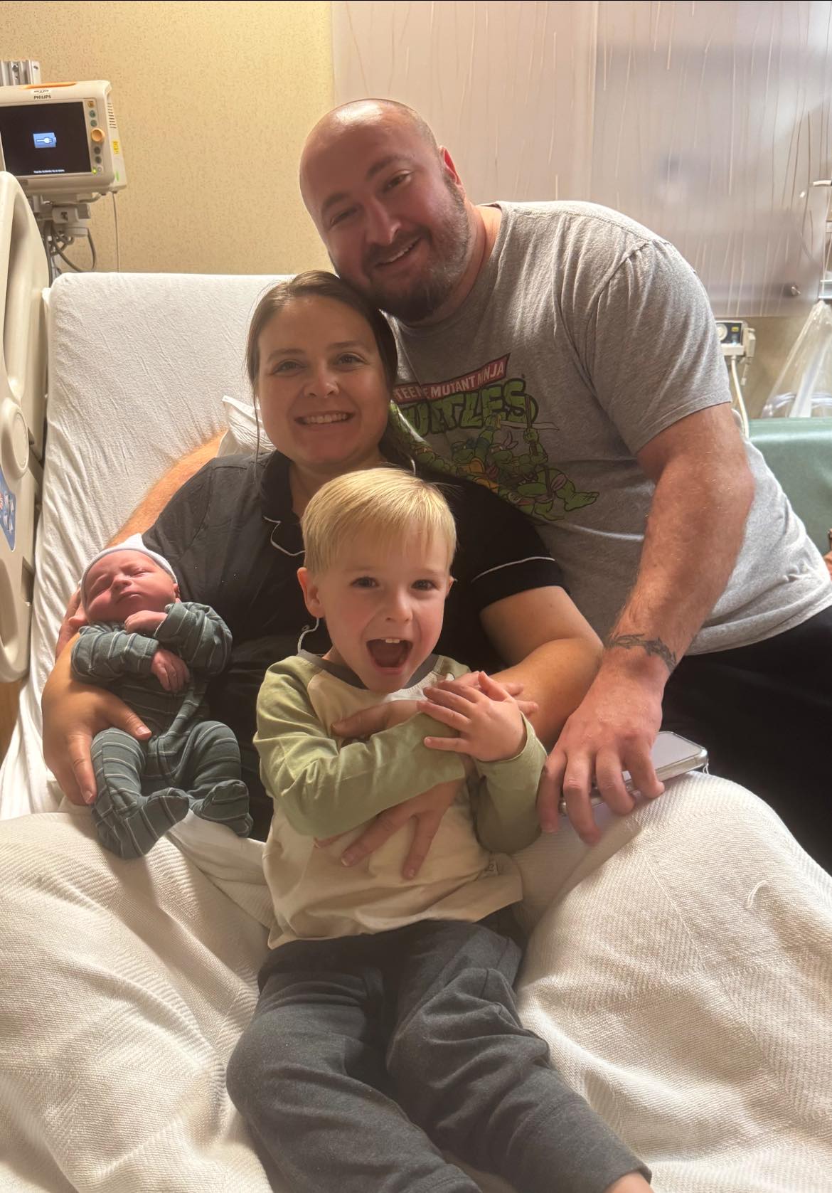 Caleb Michael McGennis, entrepreneur and founder, with family at hospital celebrating Raphael's birth in Jefferson City, Missouri