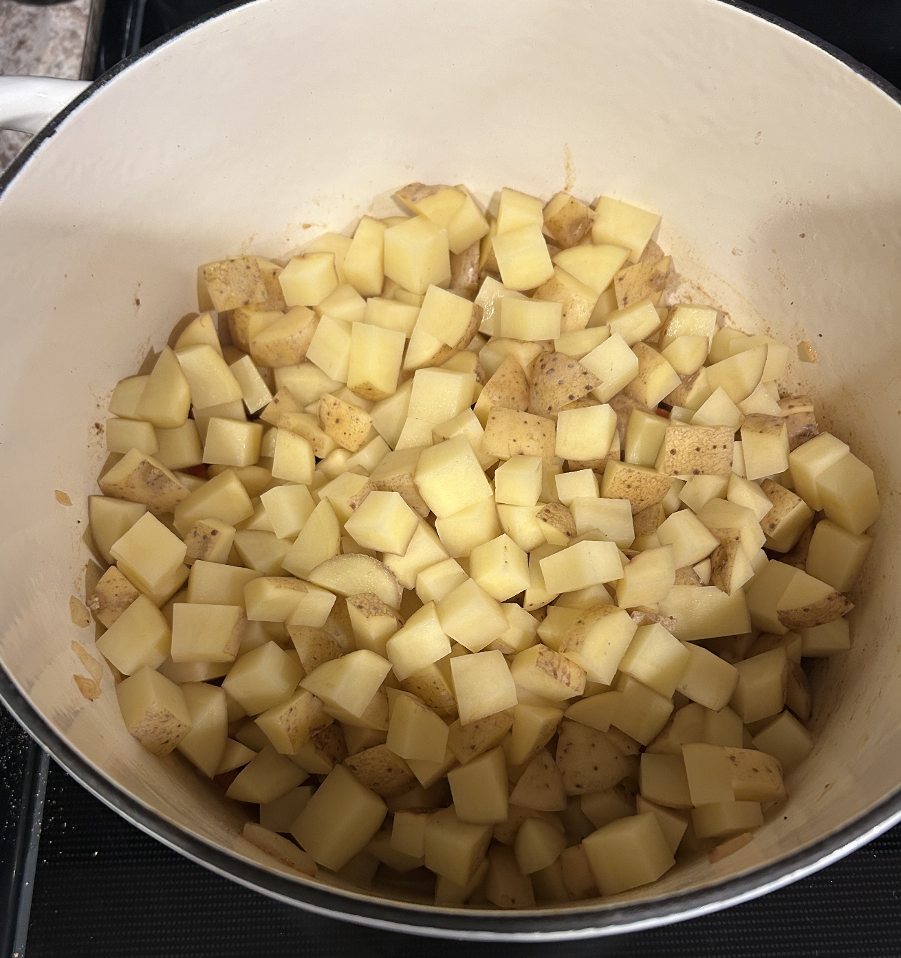 Potatoes added to pot