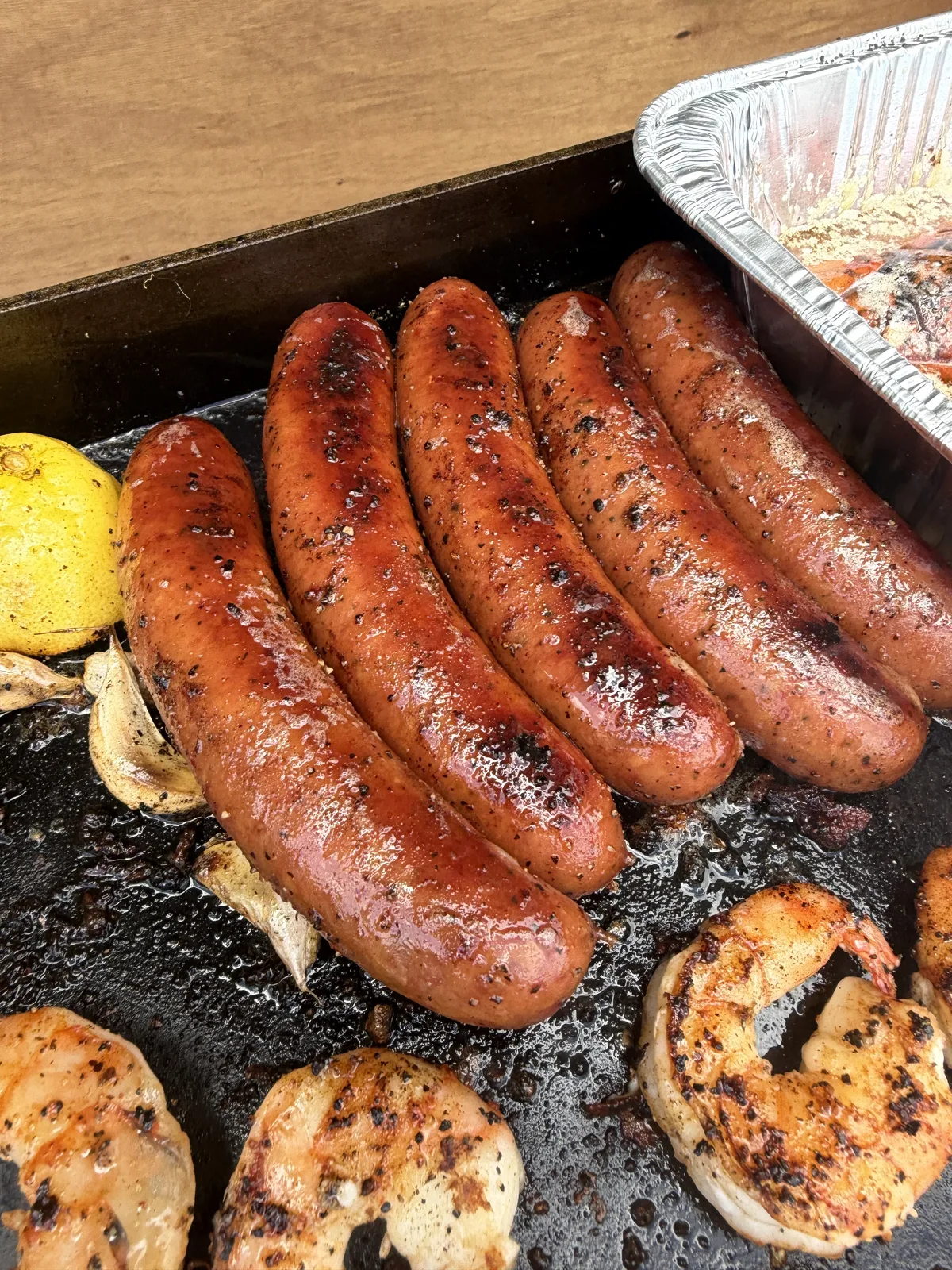 Andouille sausage links searing on the Blackstone griddle