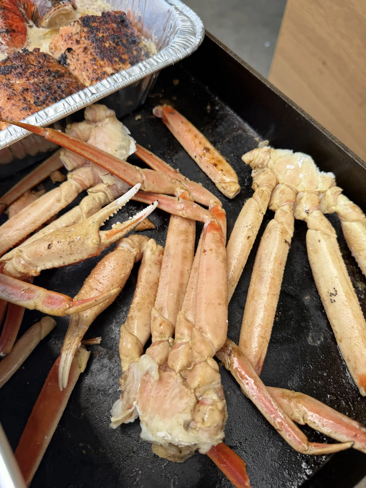 Snow crab clusters heating on the griddle