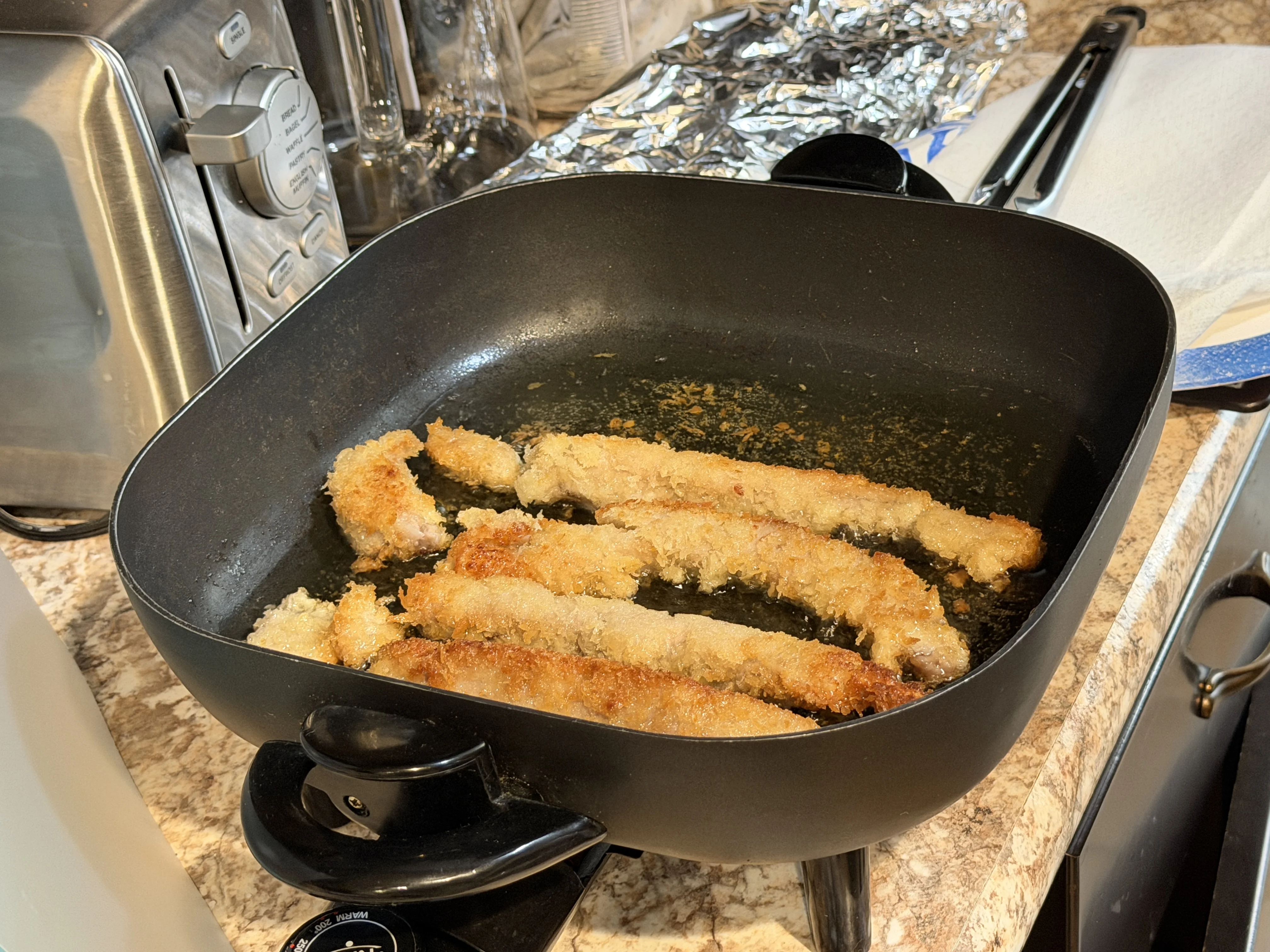 Tuna tempura frying in grape seed oil